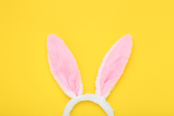 Easter rabbit ears on yellow background