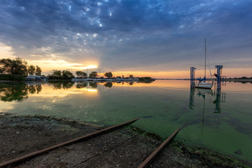Pavlov dock - a picturesque bay with a small boat dock in the foreground a boat that is pulled ashore by rails