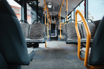 Empty public bus interior during coronavirus pandemic.