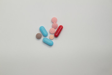 Colored pills on white background Legal drugs in the form of tablets. Medicines for use in humans.