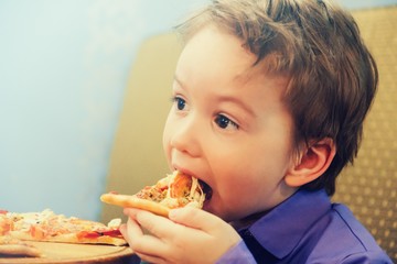 Hungry child eat slice pizza,  fast.Hungry child eat slice pizza,  fast.
