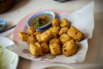 Portion of fried tofu over the table