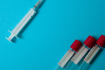 Coronavirus medicine and treatment concept. Syringe and blood test tubes