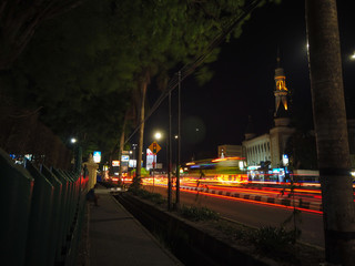 Fototapeta na wymiar Long shot traffic light and mosque