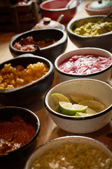 guacamole and garnishes for tacos and chili