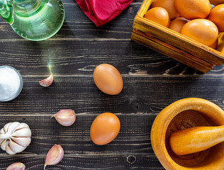 Garlic heads, eggs, salt and oil distributed to prepare the sauce ajoaceite typical of Spanish food