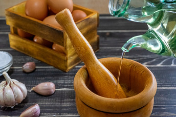 Garlic heads, eggs, salt and oil distributed to prepare the sauce ajoaceite typical of Spanish food