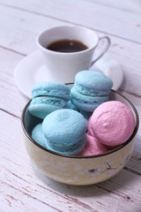 Close up of blue and pink color macaroon in a bowl 