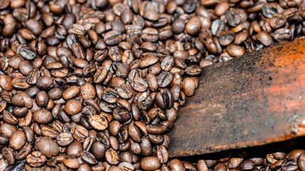 Roasting coffee bean in brass pan