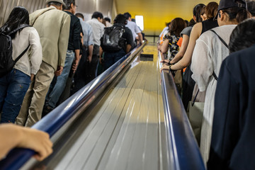 people in escalator of Tokyo subway
