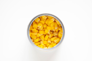 Sweet canned corn isolated over the white background. top view.