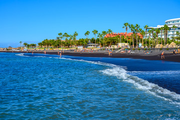 All year sun vacation destination, blue ocean water on  beach Playa del Duque in Costa Adeje, Tenerife island, Canary, Spain