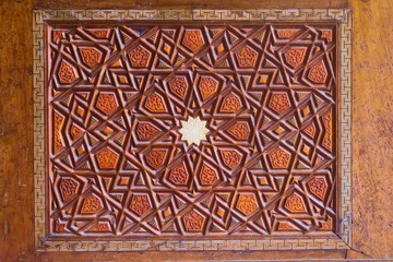 Geometrical pattern on a wooden door at a the Sehzade Mosque in Istanbul, Turkey. Islamic art, woodwork, detail close up.
