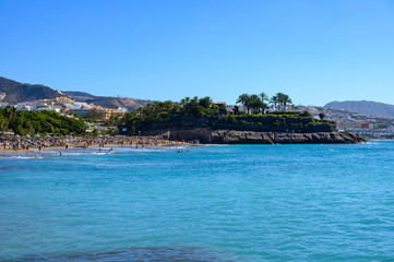 All year sun vacation destination, blue ocean water on  beach Playa del Duque in Costa Adeje, Tenerife island, Canary, Spain