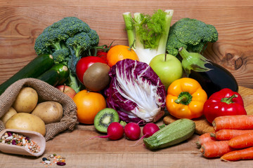 Colorful fruits and vegetables on wooden  background