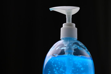 clean alcohol gel medical on black background