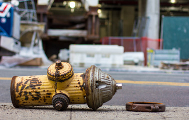 Broken fire hydrant on sidewalk