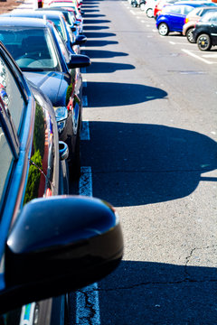 Busy street parking in small city in Spain