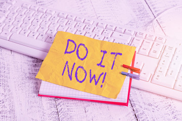 Conceptual hand writing showing Do It Now. Concept meaning not hesitate and start working or doing...