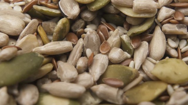 Raw shelled sunflower seends and pumpkin seeds, macro shot