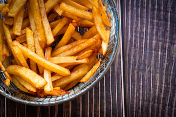 potatoes fries in bowl of grill fryer closeup