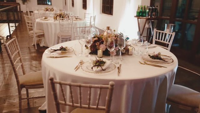 Round table and chiavari chairs decorated for the banquet celebration, delicate table serving in the restaurant, wedding celebration
