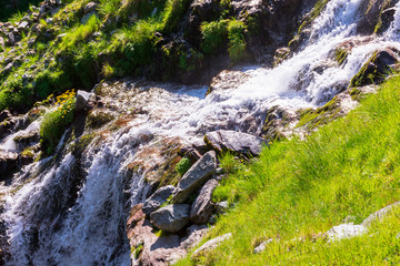 cascade of balea stream. nature scenery of fagaras mountains on a sunny summer day