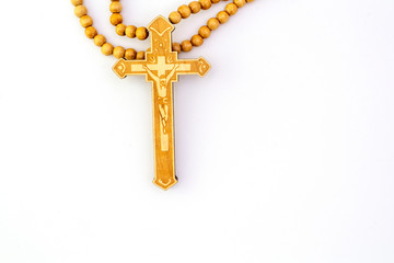 Crucifix necklace  The top has a light brown Jesus on a white background.