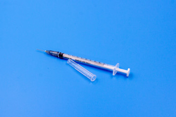 syringe  on blue background