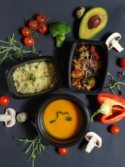 Culinary dishes made from natural products on a colored plate on a background with ingredients for cooking. Healthy eating concept. Top view.