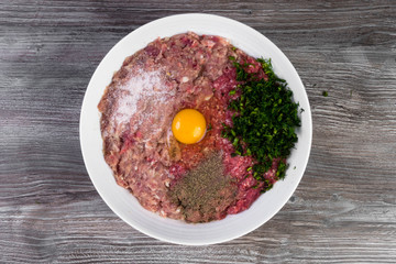 Minced meat with pepper, dill, salt, prepared for cooking