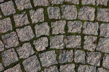 The road of square stones. The texture of the antique road.