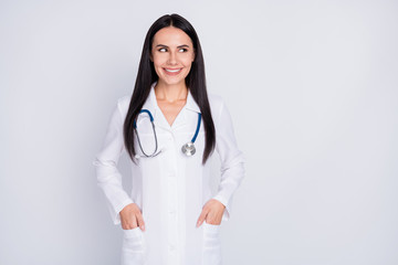 Photo of attractive friendly doctor lady consultation rehabilitation center professional look empty space wear white long lab coat stethoscope isolated grey color background