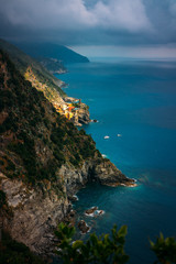 Beautiful scenic view of Mediterranean turquoise sea visible from the hiking Cinque Terre trail from Vernazza to Monterosso al Mare in Italy. 