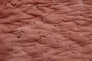 Texture of light pink pleated surface with folds
