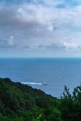 Fototapeta na wymiar Beautiful scenic view of Mediterranean turquoise sea visible from the hiking Cinque Terre trail from Vernazza to Monterosso al Mare in Italy. 