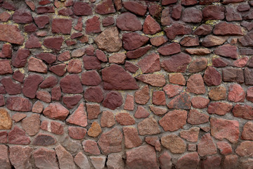 Red stones. Sidewalk made of red stones.