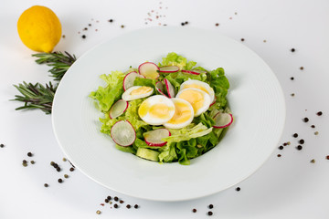 Green salad with radishes and eggs