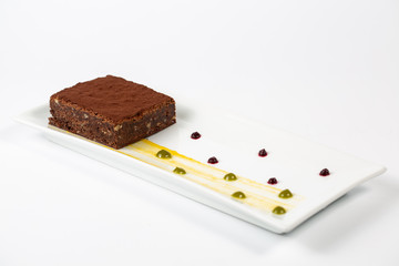 chocolate brownie in plate on a white background