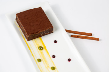chocolate brownie in plate on a white background