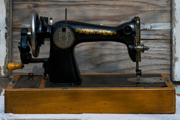 Vintage sewing machine. Retro. History of sewing. Cover, elements and details of a sewing machine close-up. Macro photo.