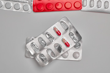 Empty pill box. Pills for the treatment of viral infections. Influenza and Coronovirus Prevention, Covid 19. Medicines on a gray background.