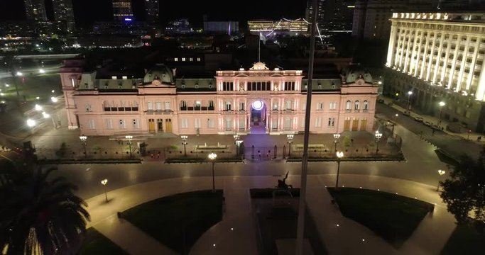 Aerial Drone Scene at night of May Square and Casa Rosada. Landscape of the pyramid and pink house, historic building. Buenos Aires, Argentina.