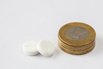 medicine pills with indian coin