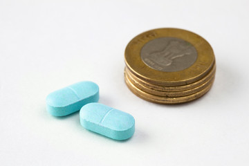 indian rupees with medicine pills