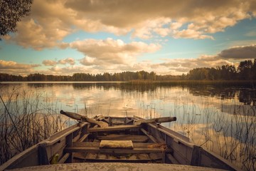 Old fishing boat on the lakeshore. Latvia