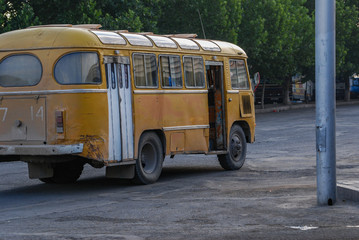 Old yellow bus on street of Bishkek, Kyrgyzstan.