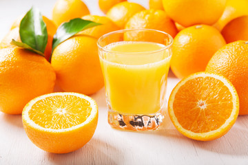 glass of fresh orange juice with fresh fruits