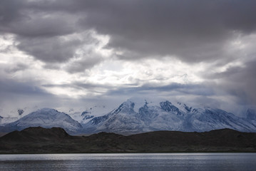 Fototapeta na wymiar Kala Kule Lake with dramatic sky. Altay Prefecture, Xinjiang, China.