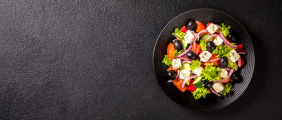 Greek salad of fresh vegetables, olives and feta. Traditional Mediterranean food.Banner